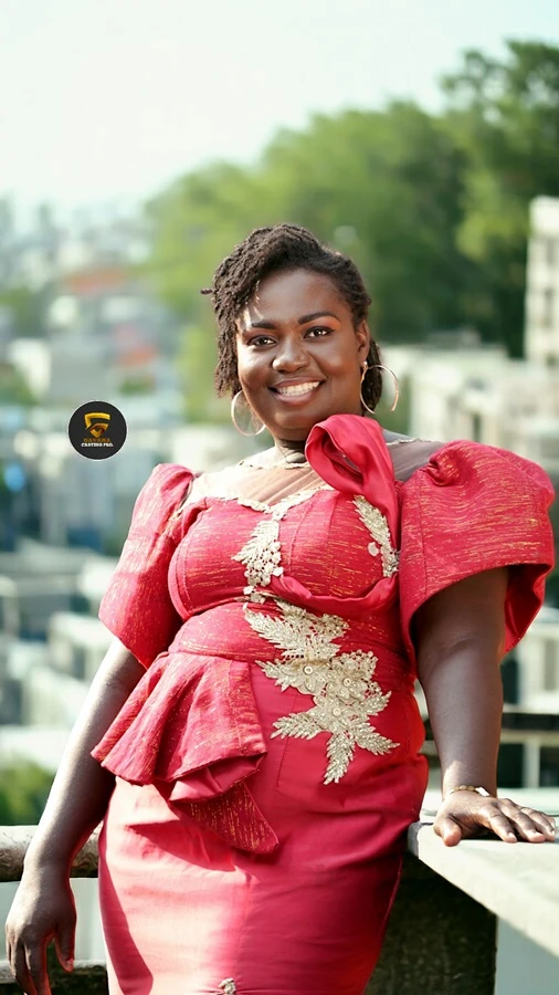 Confident plus-size Ghanaian model posing in stylish outfit