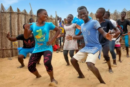 Casting team speaking with people on a Ghanaian street
