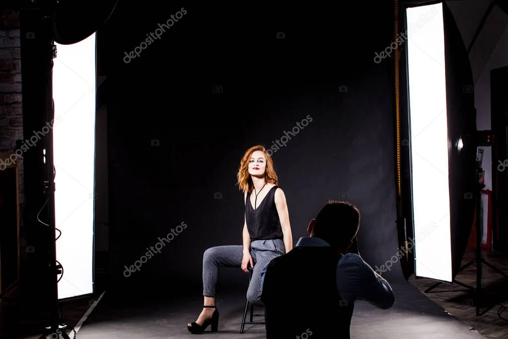Model posing and smiling in a studio photoshoot