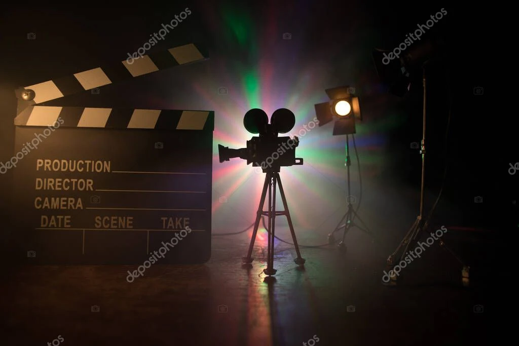 Actor on a film set receiving coaching in front of a camera
