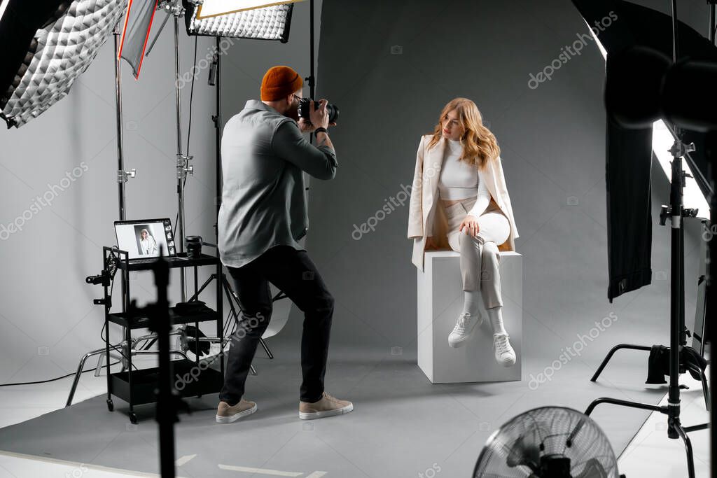 Fashion team directing a model in an editorial photoshoot